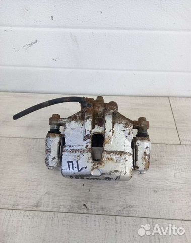 Суппорт передний левый Kia Cerato 2