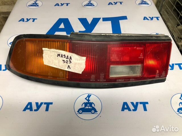 Задний фонарь Мазда 323 левый